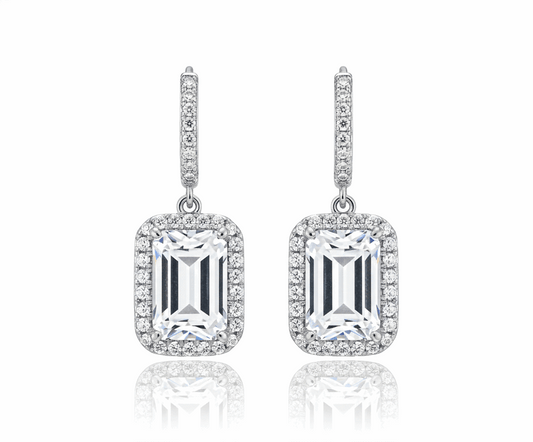 Pair of diamond earrings on a white background