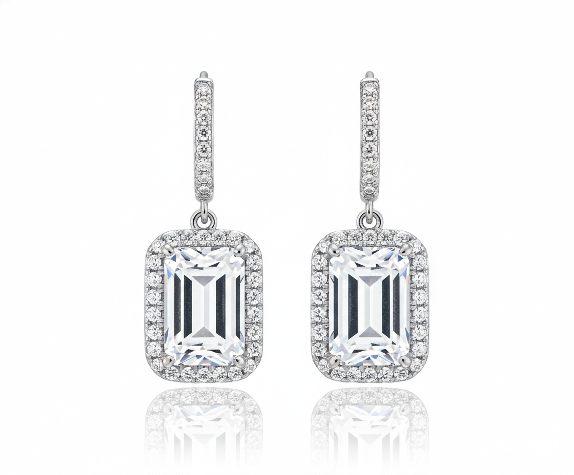 Pair of diamond earrings on a white background