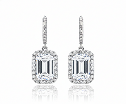 Pair of diamond earrings on a white background