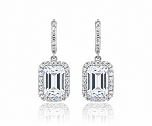 Pair of diamond earrings on a white background