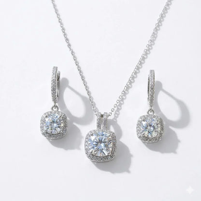 Elegant cushion-cut diamond necklace and matching hoop earrings with halo setting
