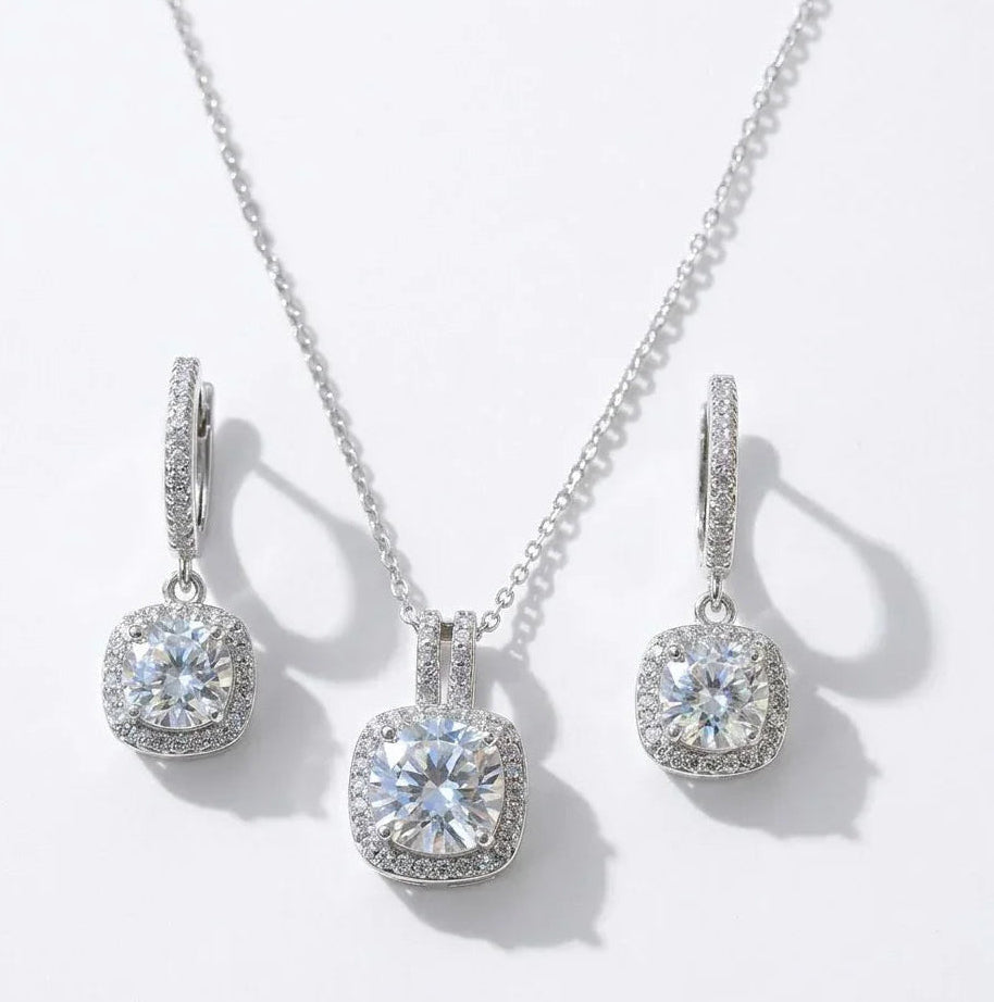 Elegant cushion-cut diamond necklace and matching hoop earrings with halo setting