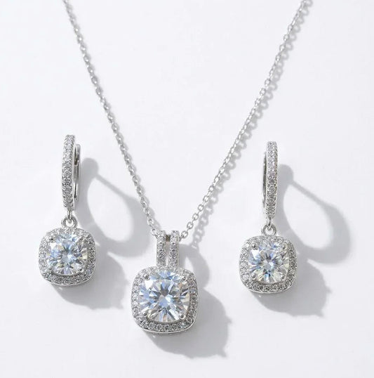 Elegant cushion-cut diamond necklace and matching hoop earrings with halo setting