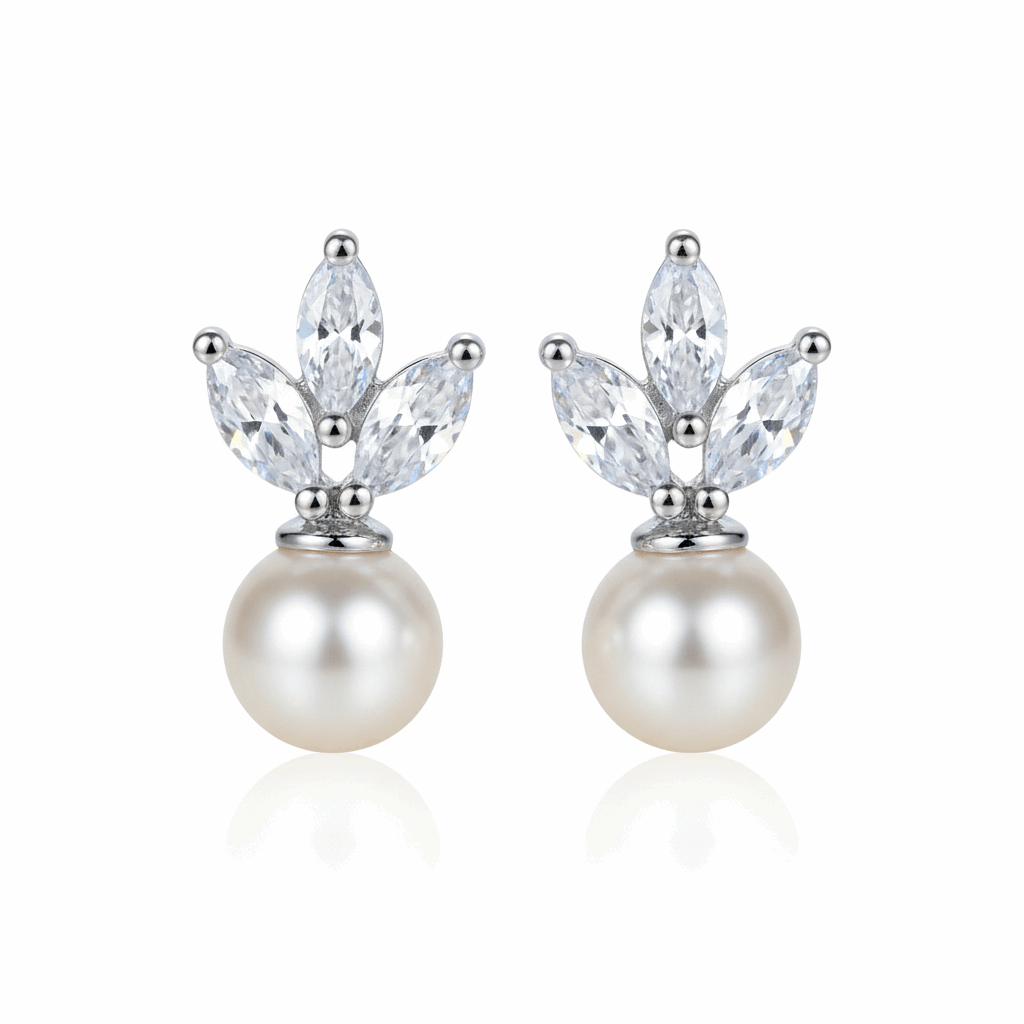 Pair of pearl earrings with crystal-like stones on a white background