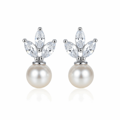 Pair of pearl earrings with crystal-like stones on a white background