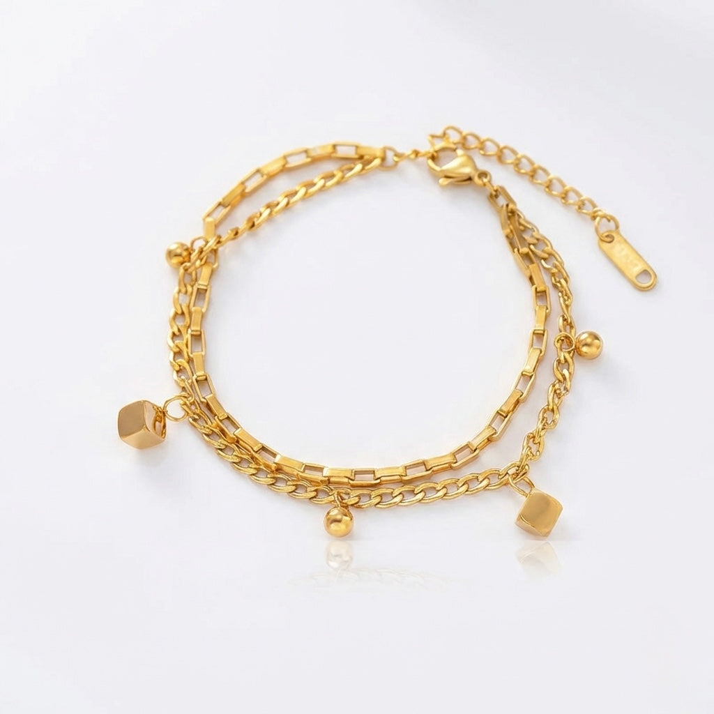 Gold multi layered chain bracelet with small hexagonal charms