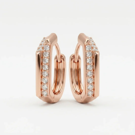 Champagne gold hoop earrings with diamond accents on a light gray background