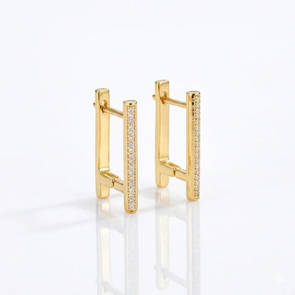 Gold bar earrings with sparkling diamond accents, modern minimalist design