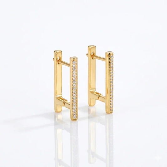 Gold bar earrings with sparkling diamond accents, modern minimalist design