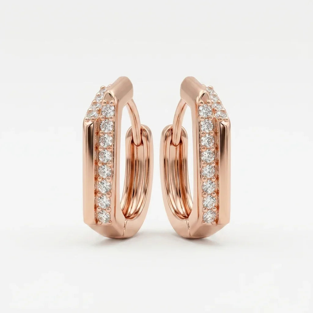 Champagne gold hoop earrings with diamond accents on a light gray background