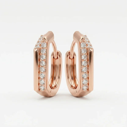 Champagne gold hoop earrings with diamond accents on a light gray background